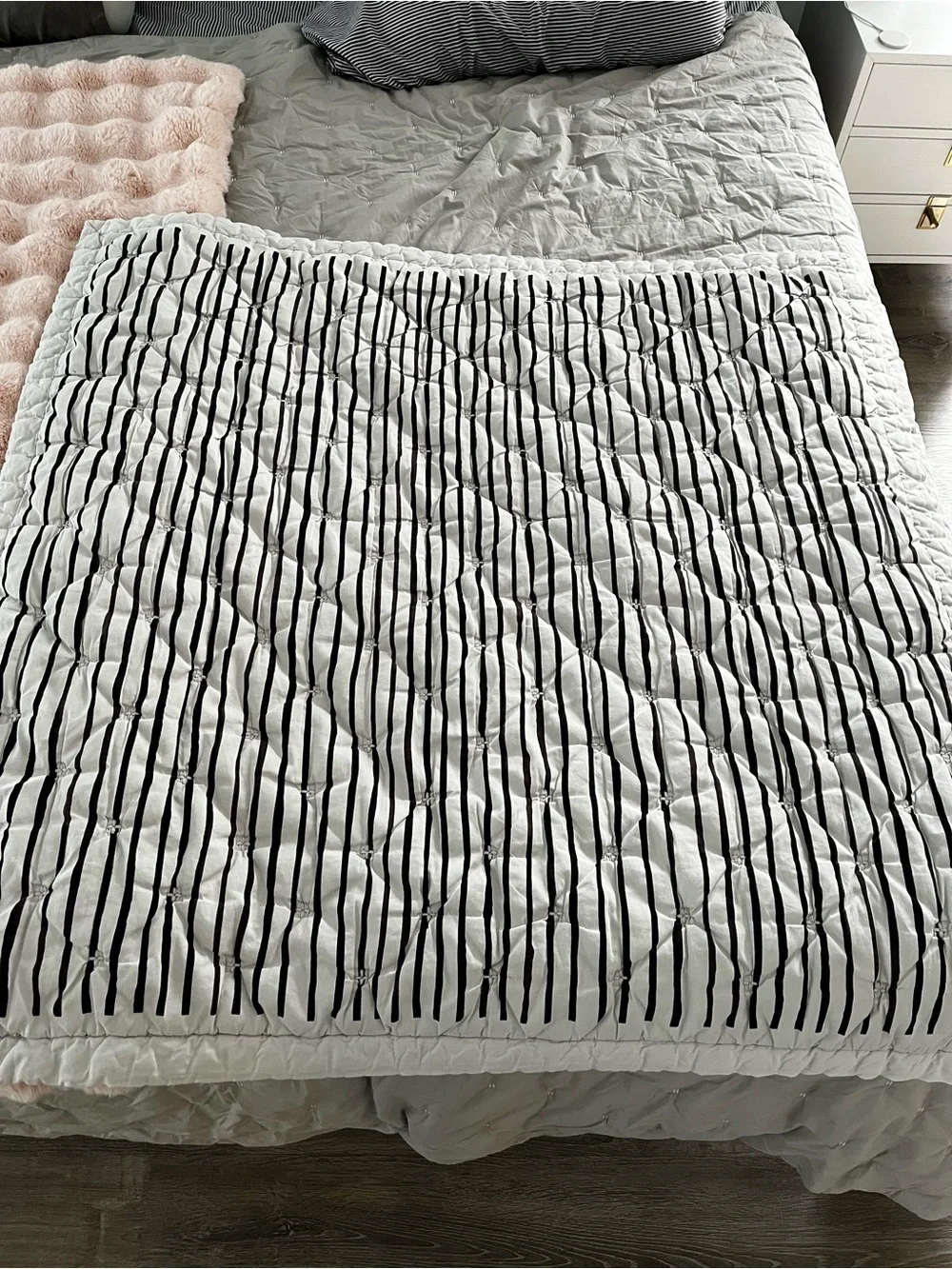 Lovevery organic comforter with animals and stripes